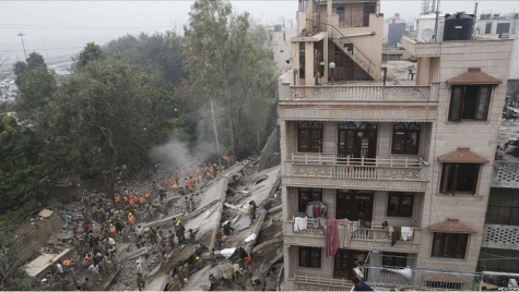 Six dead and more feared trapped in collapsed building in Delhi